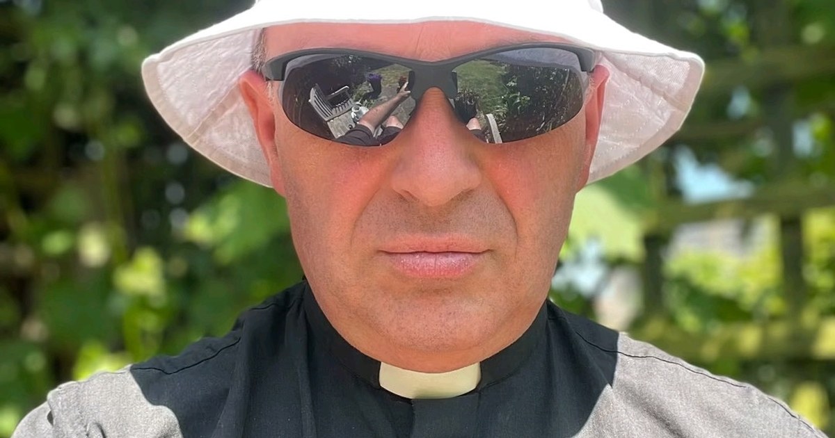 A priest from All Saints' Carshalton wearing a bucket hat and sunglasses